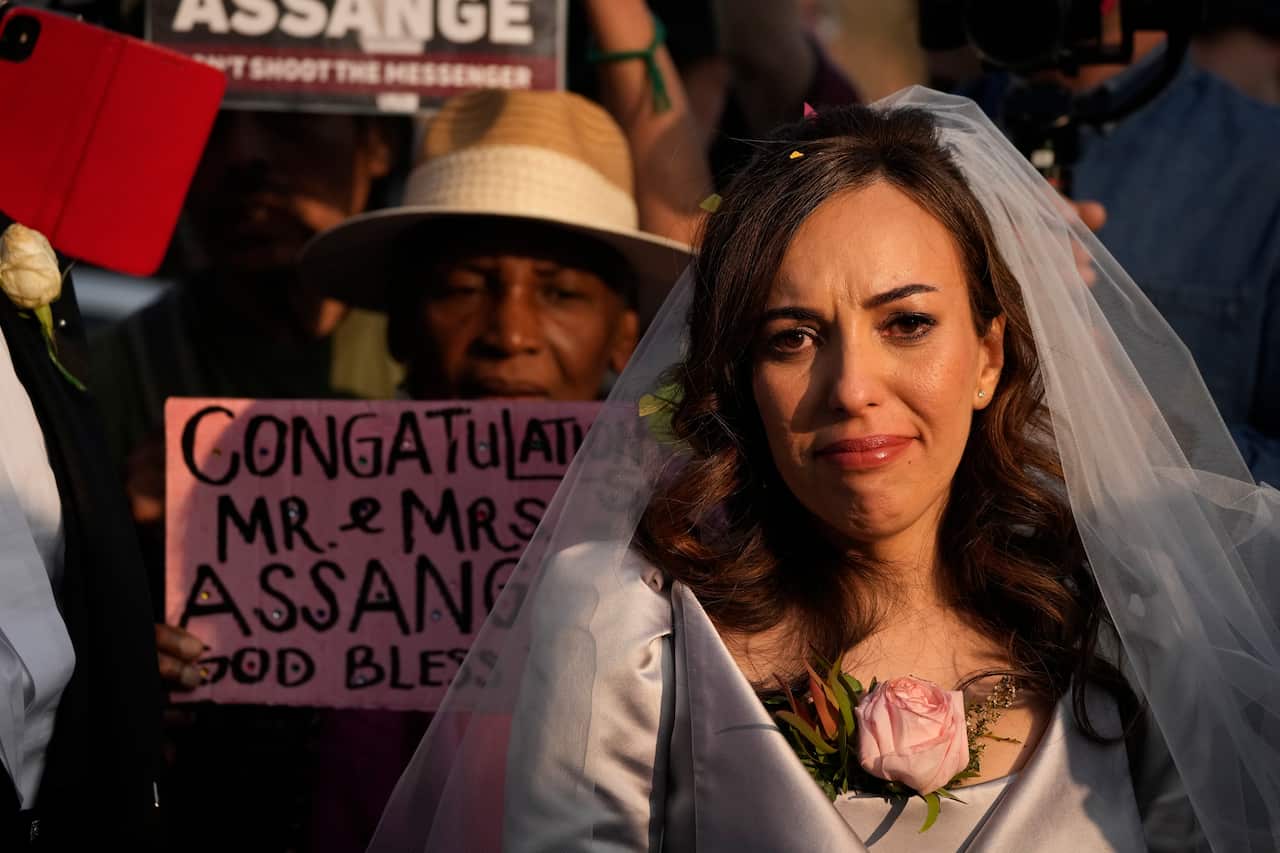 Stella Moris speaks to the media and supporters after cutting a wedding cake after marrying her partner the WikiLeaks founder Julian Assange in a small wedding service held inside the high-security Belmarsh Prison, in south east London, Wednesday, March 2
