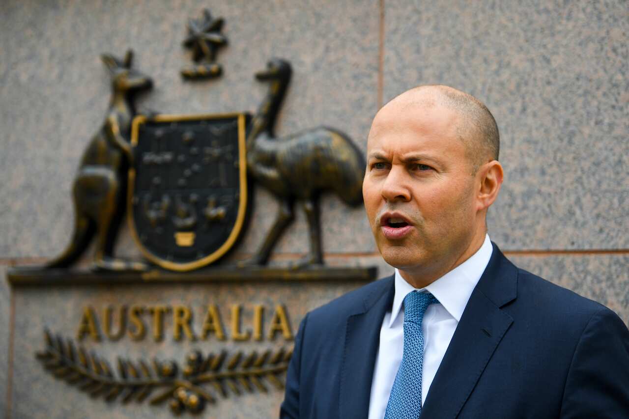 Australian Treasurer Josh Frydenberg poses for photograph outside the Treasury Department building in Canberra, Thursday, March 24, 2022. (AAP Image/Lukas Coch) NO ARCHIVING