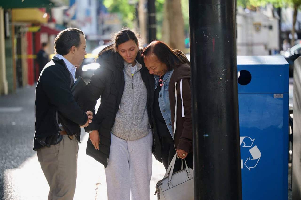 Leticia Harris, center, whose husband Sergio Harris was killed in the mass shooting in downtown Sacramento early Sunday morning, April 3, 2022