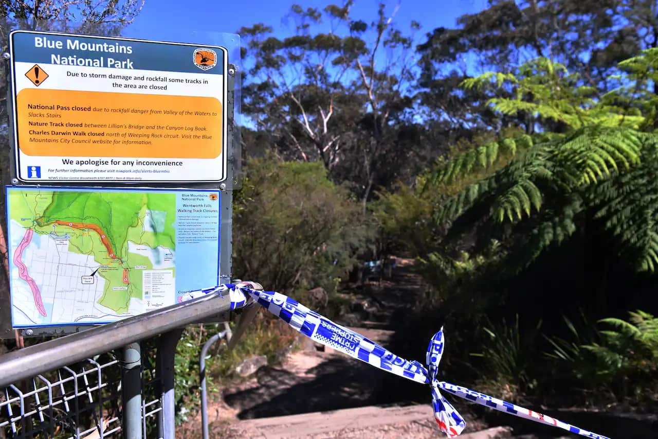 The taped off entrance to the walking track where a landslide killed two and injured two others at Wentworth Falls in the Blue Mountains, NSW, west of Sydney.