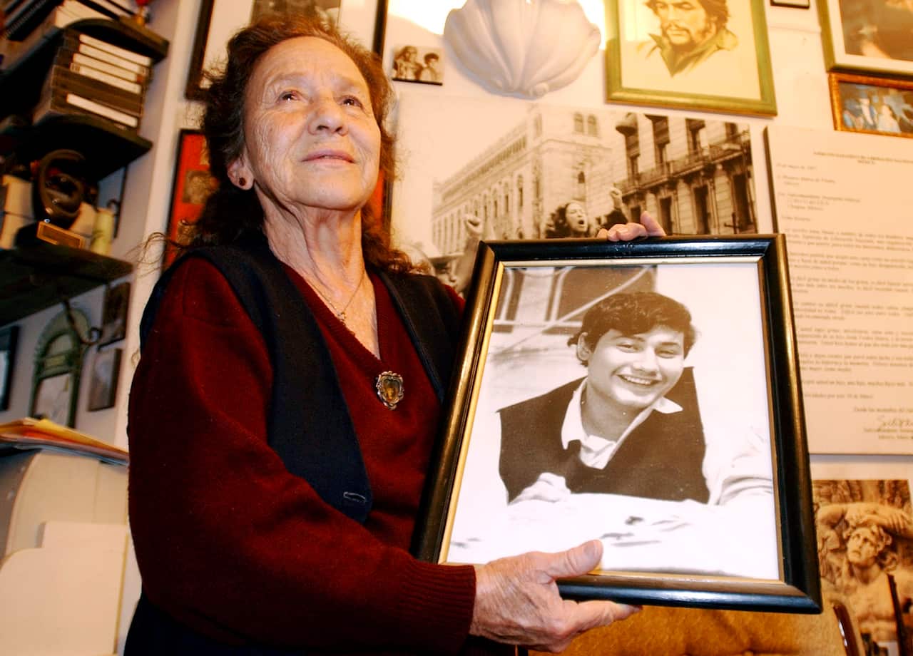 Mexico's human rights fighter Rosario Ibarra de PIedra shows a photo of her son   Jesus Piedra Ibarra who  disapeared during Mexico's so called  "dirty war"
