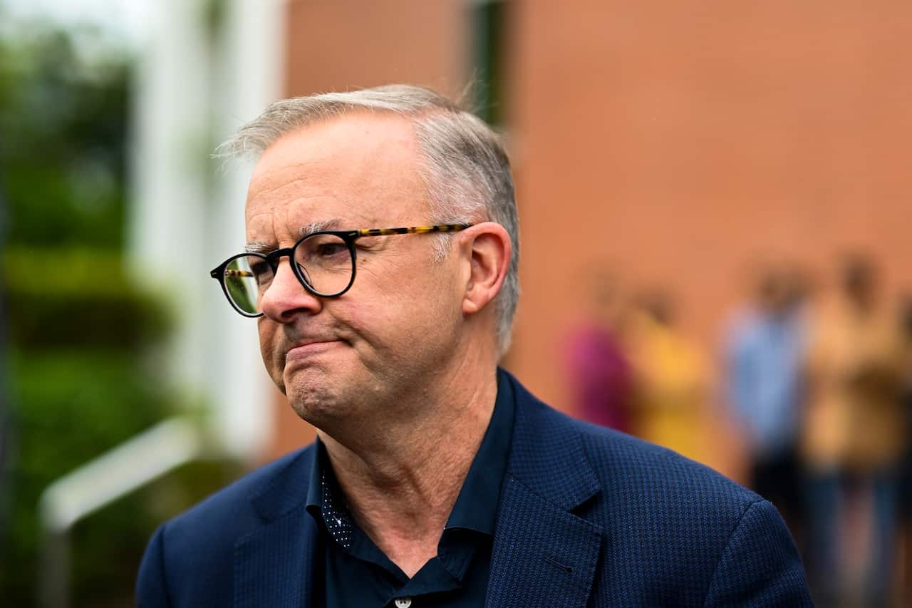 Australian Opposition Leader Anthony Albanese speaks to the media clarifying an earlier answer after attending the Easter Sunday mass at St. Monicas on Day 7 of the 2022 federal election campaign, in Cairns, Sunday, April 17, 2022. (AAP Image/Lukas Coch) 