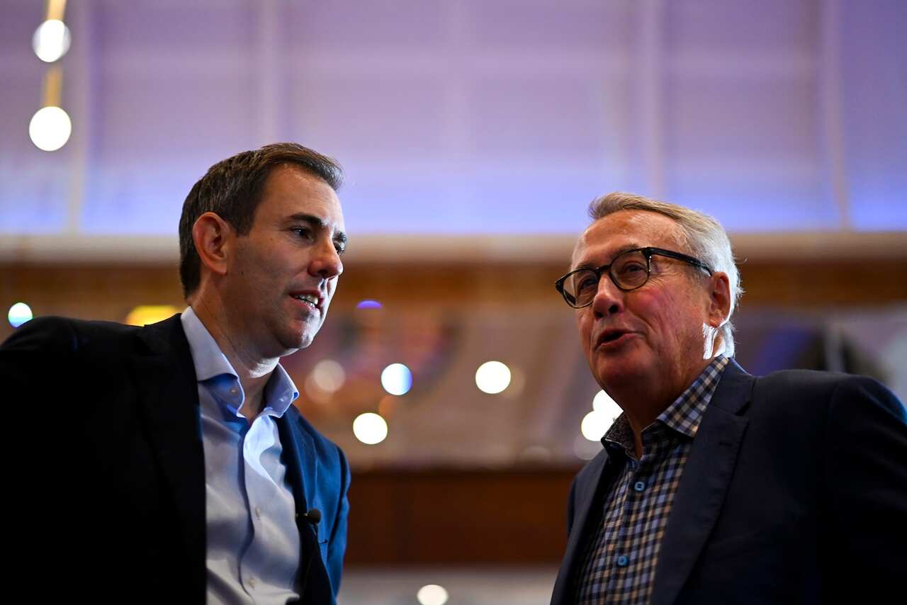 Shadow Treasurer Jim Chalmers (left) speaks to former Australian Treasurer Wayne Swan at his official campaign launch on Day 13 of the 2022 federal election campaign, in Logan