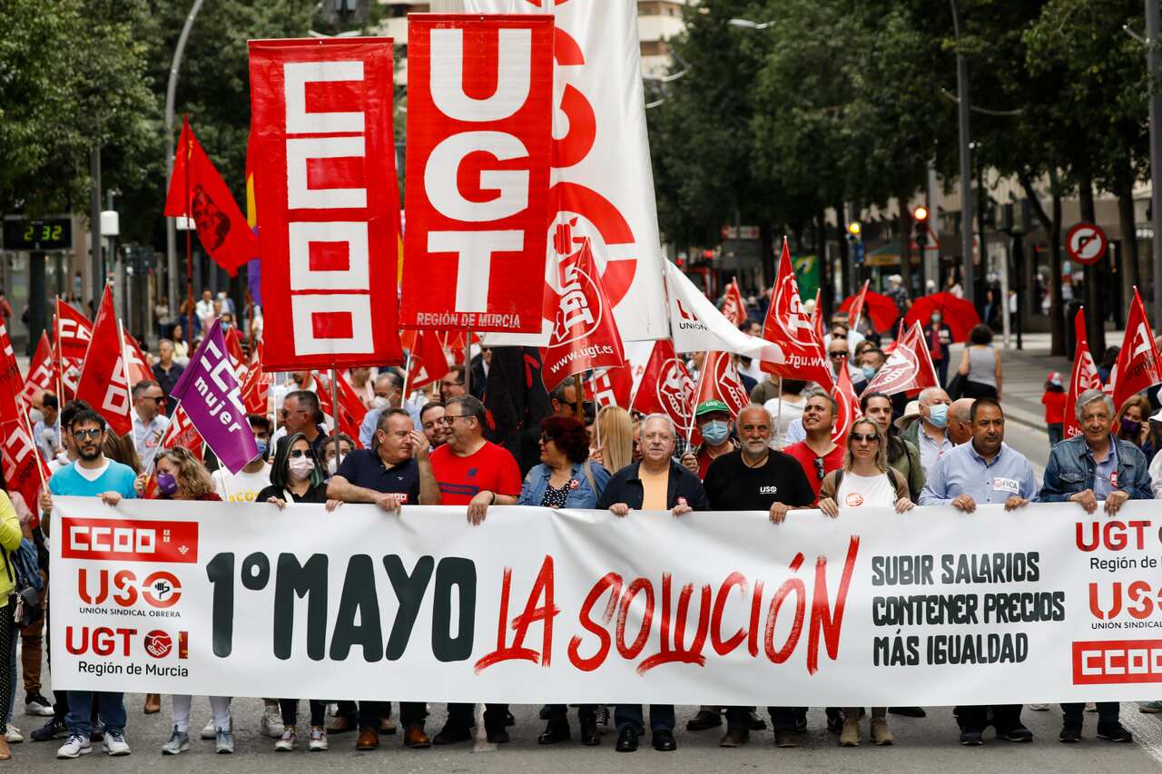 Several people holding a banner during the demonstration for International Workers' Day, May 1, 2022, in Murcia (Spain).