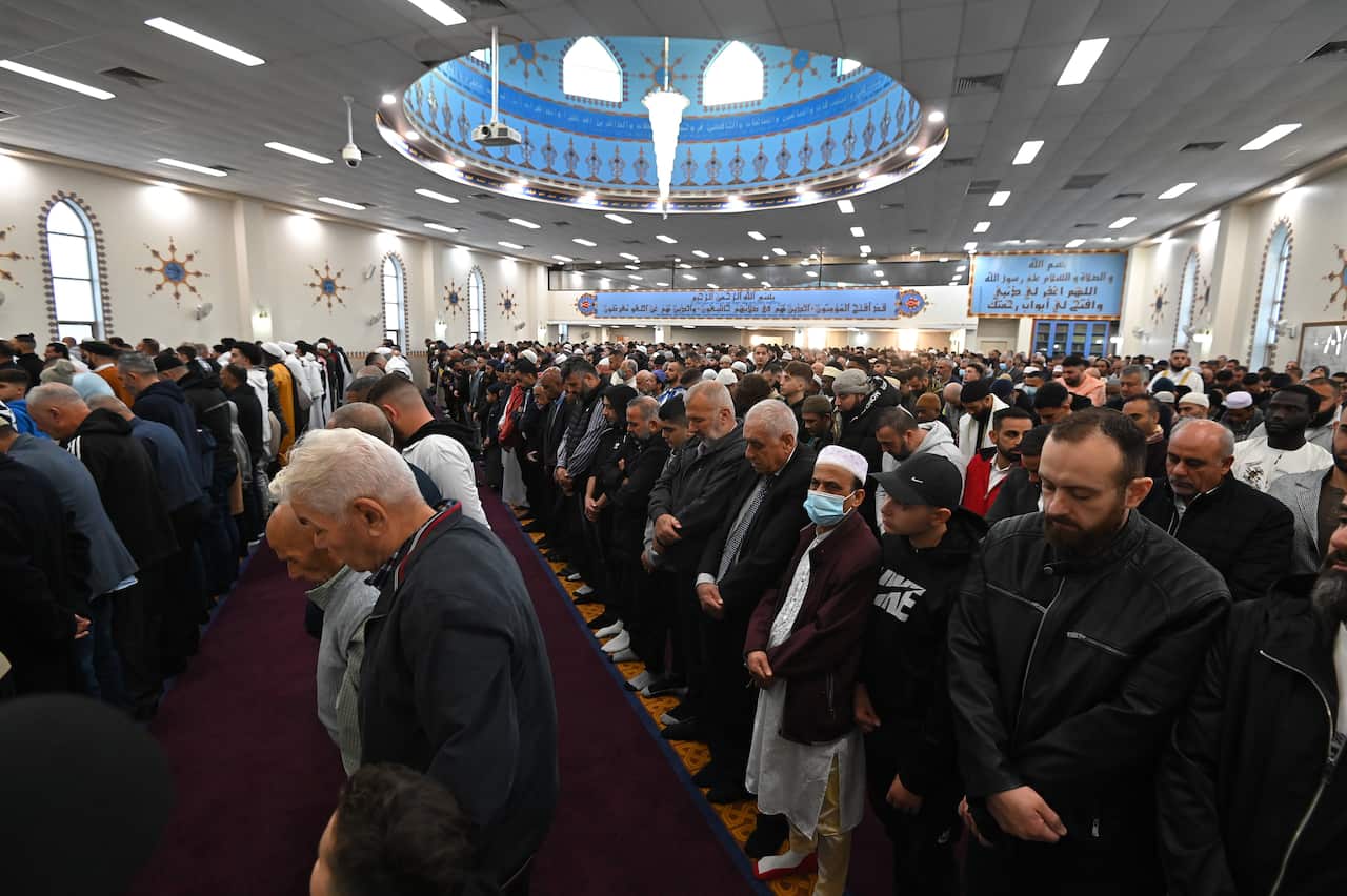 Worshippers participate in Eid al-Fitr prayers, signifying the end of the holy month of Ramadan, at the Lakemba Mosque in Sydney, Monday, May 02, 2022. (AAP Image/Steven Saphore) NO ARCHIVING