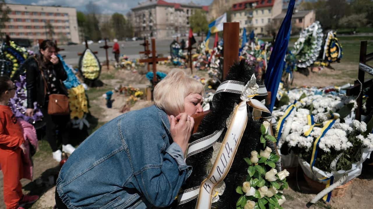 People visit the Lychakiv Cemetery in Lviv, Ukraine on May 1, 2022. Many people mourned and prayed for the victims of Russian invasion at the graveyard.