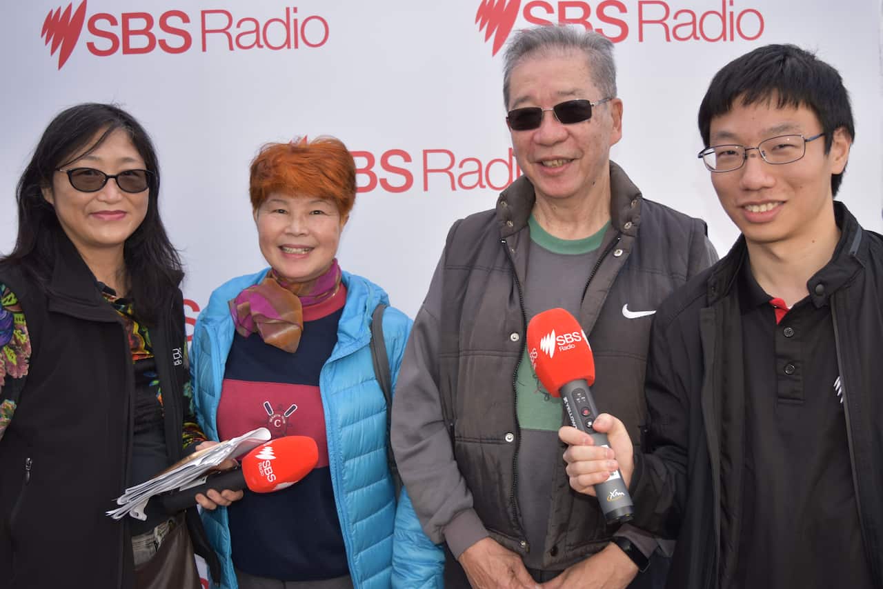 Chinese Australian voters Mr and Mrs Chan  between SBS Chinese' Selina Kong (left) and Winmas Yu (right) at the Election Exchange in Eastwood, Sydney.