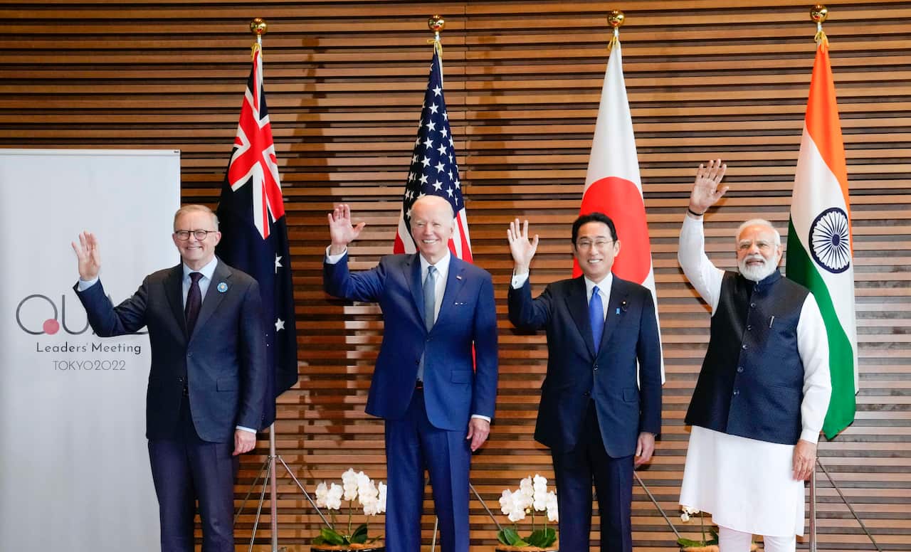 PM Anthony Albanese, U.S. President Joe Biden, Japanese PM Fumio Kishida and Indian PM Narendra Modi wave ahead of the summit of the "Quad" group in Tokyo.