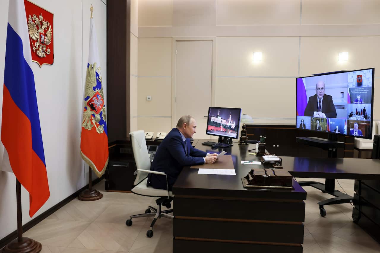 Russian President Vladimir Putin attends a meeting on economic issues via videoconference at the Novo-Ogaryovo residence outside Moscow, Russia, Tuesday, June 7, 2022. (Mikhail Metzel, Sputnik, Kremlin Pool Photo via AP)