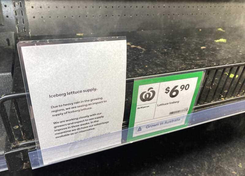 An empty lettuce shelf is seen at Camp Hill Woolworths Supermarket in Brisbane, Wednesday, June 8, 2022. Australia is facing a lettuce shortage causing a lack of stock and high prices after heavy flooding across the east coast wiped out much of the lettuc
