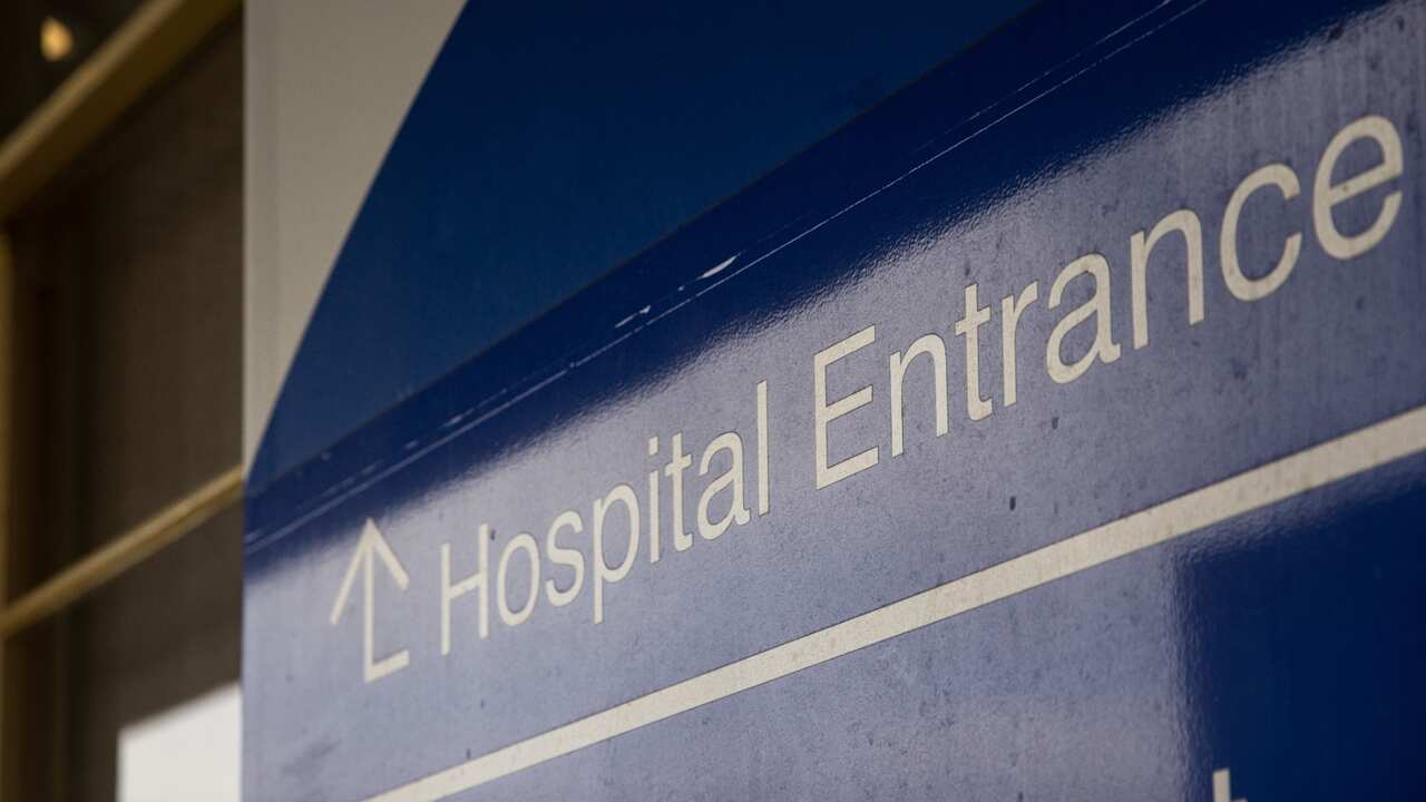 Signage is seen at a hospital in Melbourne, Friday, June 17, 2022. Funding for Australia's health response to COVID-19 has been extended to the end of the year, following talks between the prime minister and state and territory leaders.   