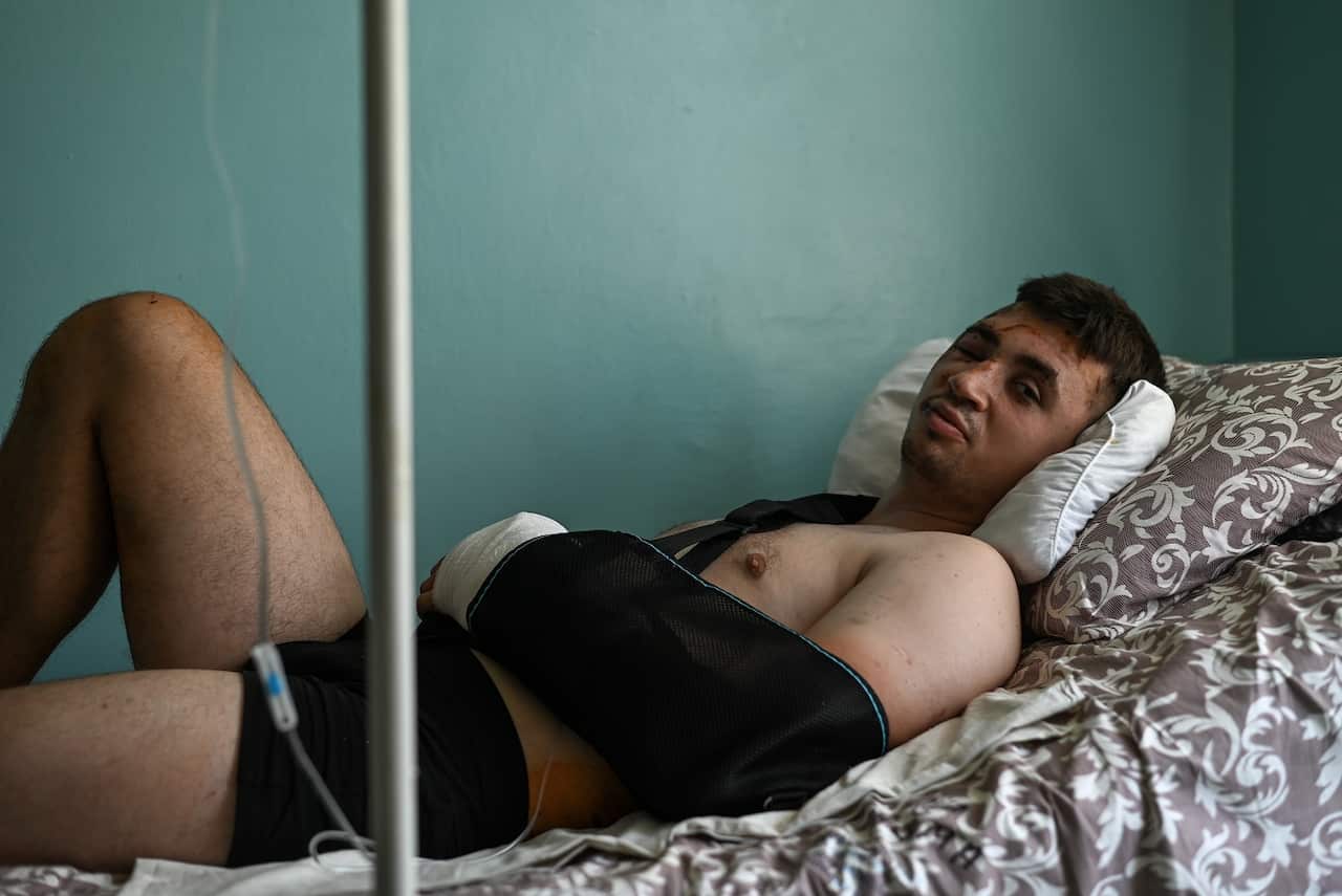 Maxim, a store clerk recovers from shrapnel wounds and concussion he received during the Russian airstrike of the Amstor shopping mall, in the Kremenchuk Intensive Care Hospital