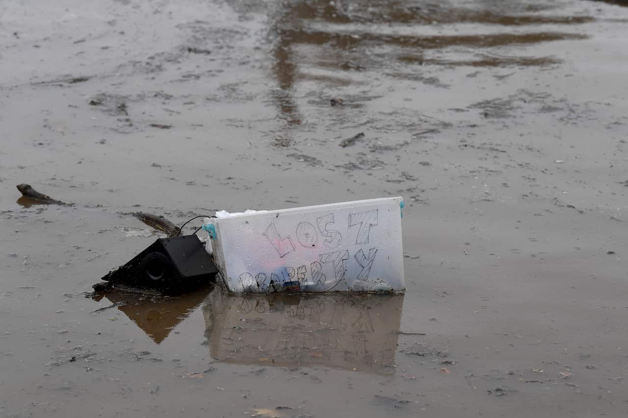 Debris is seen floating in floodwater from the swollen Hawkesbury River, in Windsor, north west of Sydney