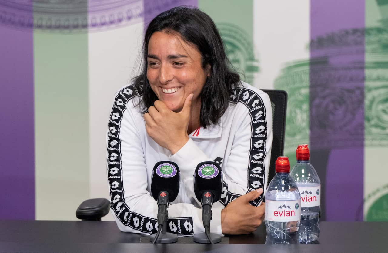 epa10057623 A handout photo made available by AELTC of Ons Jabeur of Tunisia speaking to the press in the Main Interview Room following her win against Tatjana Maria of Germany in the semi finals of the Ladies' Singles at Wimbledon Championships 2022, Wim