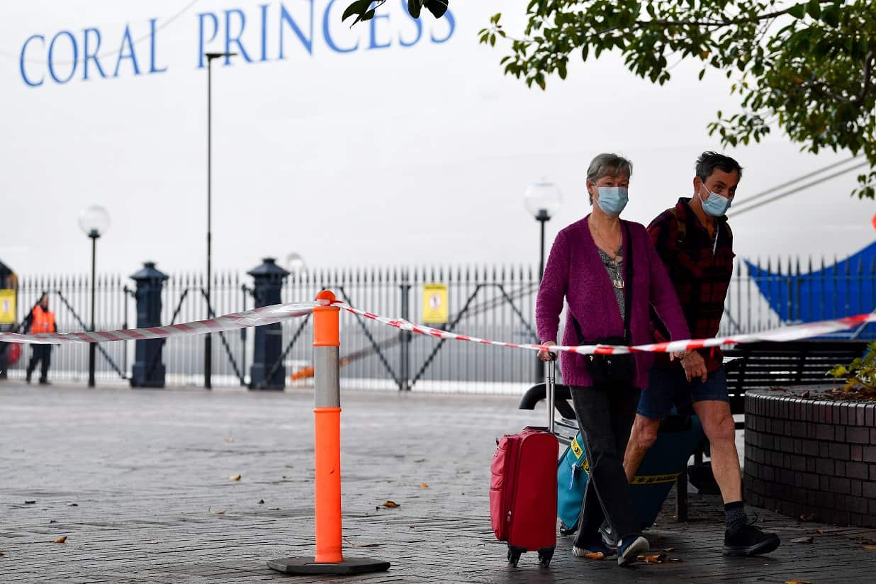 assengers disembark The Coral Princess cruise ship as it docks at Circular Quay in Sydney