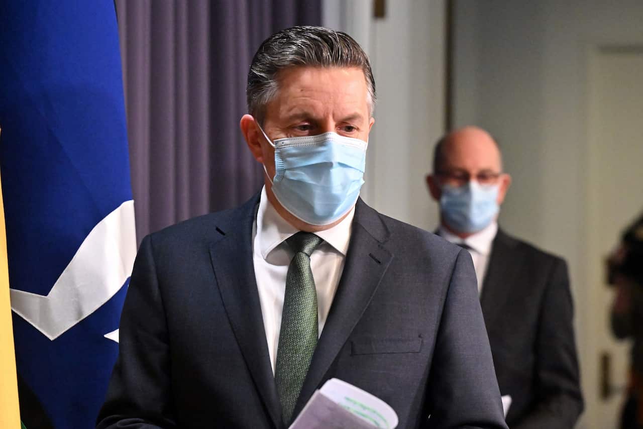 Minister for Health Mark Butler and Chief Medical Officer Paul Kelly arrive at a press conference