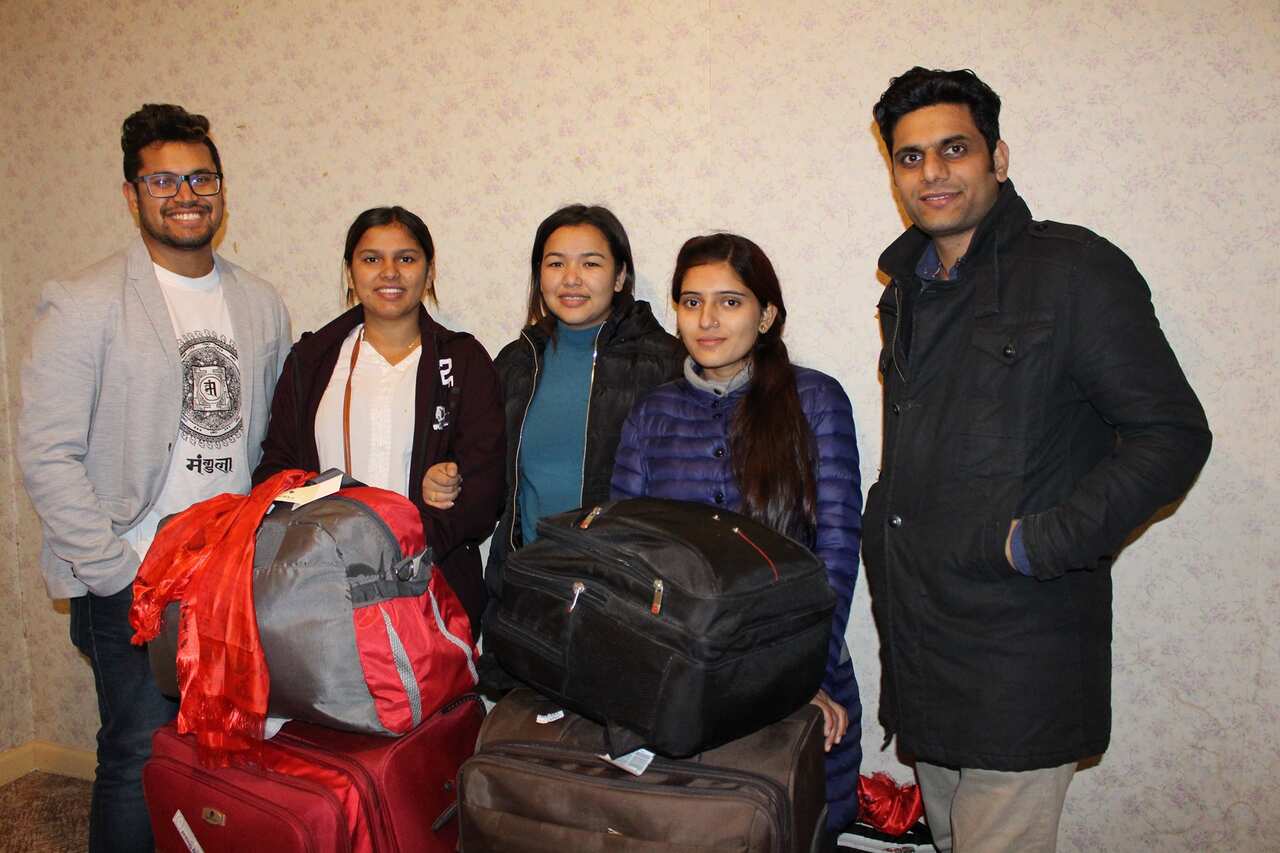 Saroj Khanal (left) with fellow volunteer with new students from Nepal.