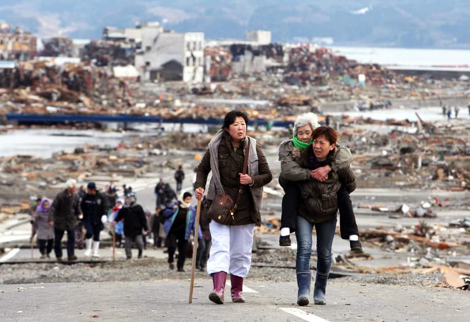 Survivors leave Tohoku a day after the March 11, 2011 earthquake and tsunami.