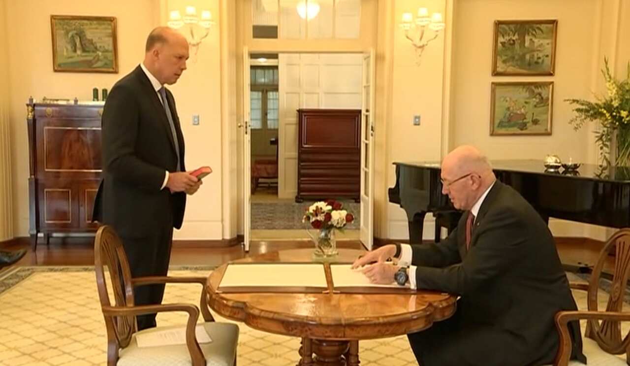 Peter Dutton reading an oath during his swearing-in ceremony.  