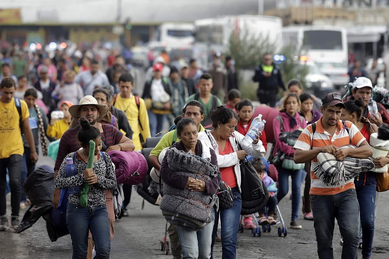 Members of the migrant caravan arrive at the shelter of the Church of the Assumption, in the city of Puebla.