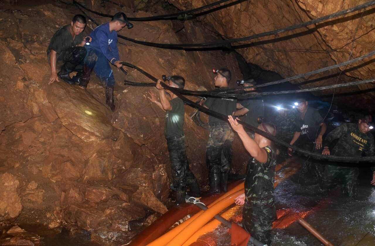 An undated handout photo released by Royal Thai Army on 02 July 2018 shows Thai soldiers loading cables in the cave complex during a rescue operation 