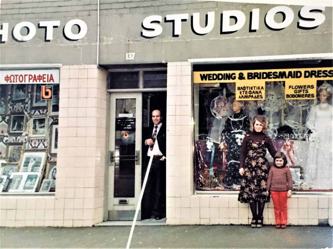 Photographer Con Papakonstantinos with his family in front of the photo studio in Fitzroy, Melbourne. 
