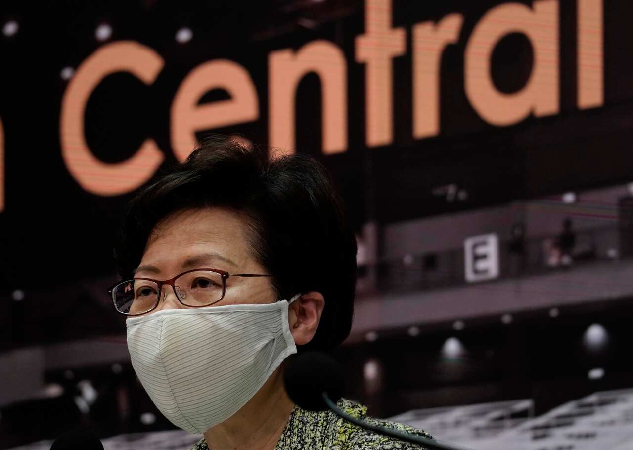 Hong Kong Chief Executive Carrie Lam listens to reporters' questions during a press conference in Hong Kong, Friday, Aug. 7, 2020.