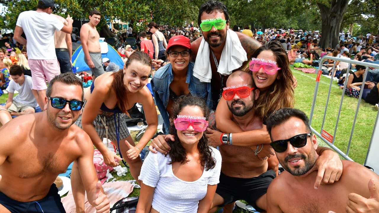 People are seen at Mrs Macquarie's Point in preparation for New Years Eve Fireworks in Sydney.
