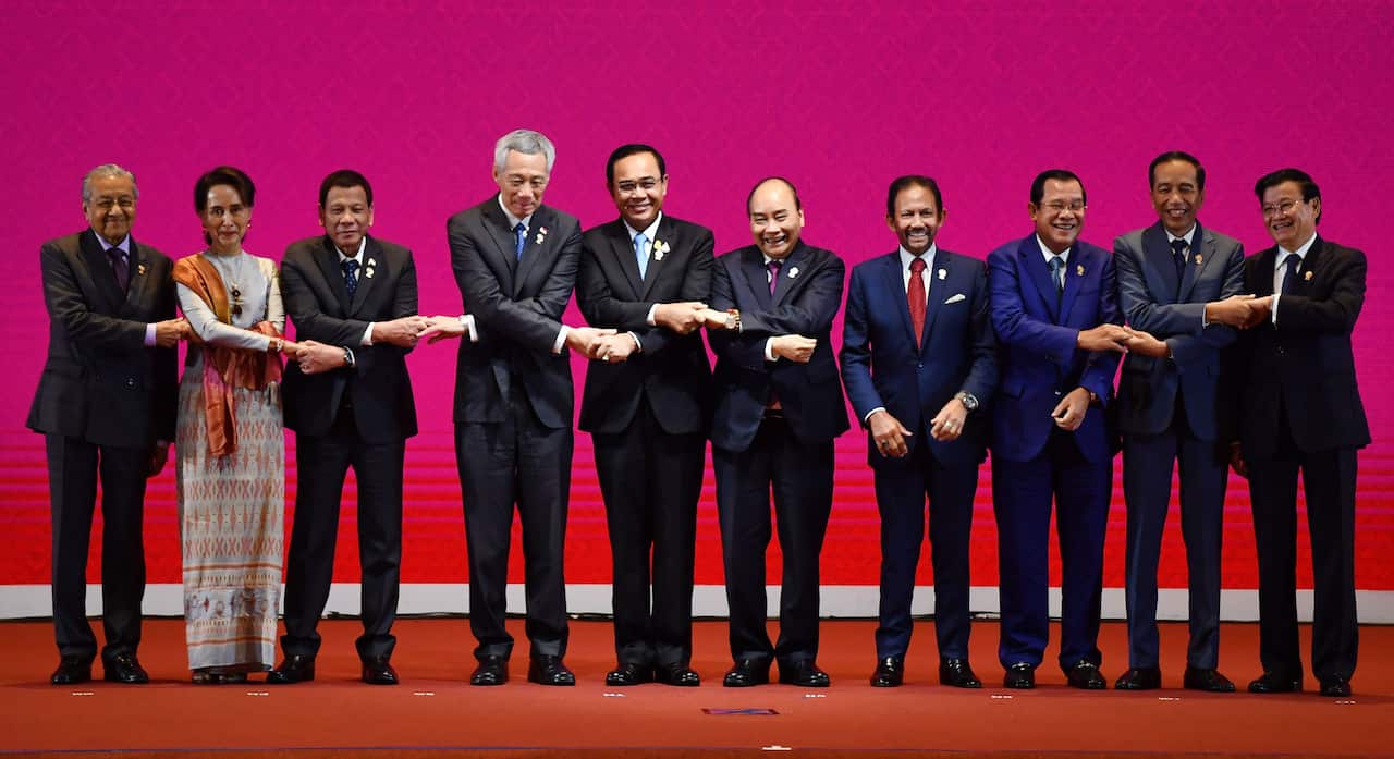 ASEAN leaders shake hands during the opening ceremony of the 35th Association of Southeast Asian Nations (ASEAN) Summit in Bangkok.