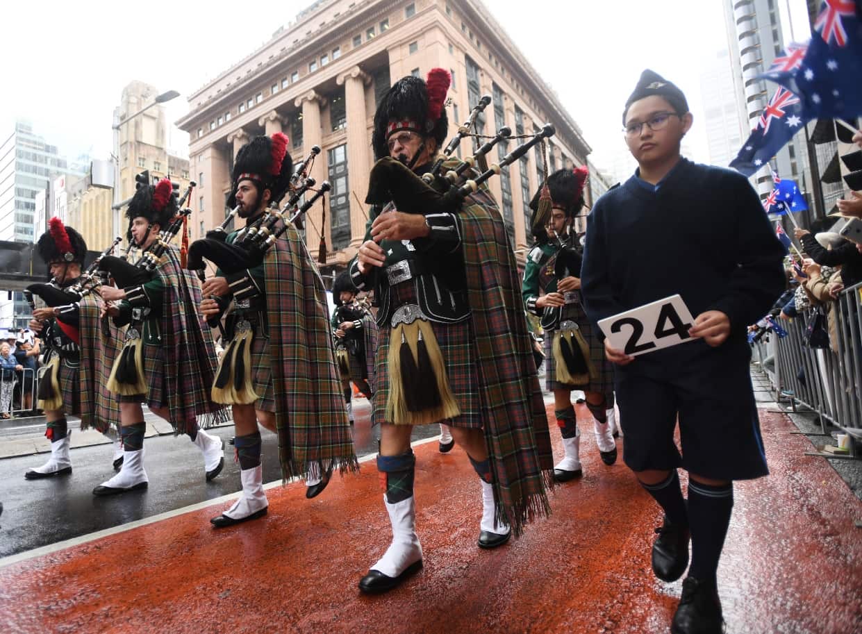 Musicians from the Hills District Pipe Band march during the Anzac Day march in Sydney, Wednesday, April 25, 2018. 