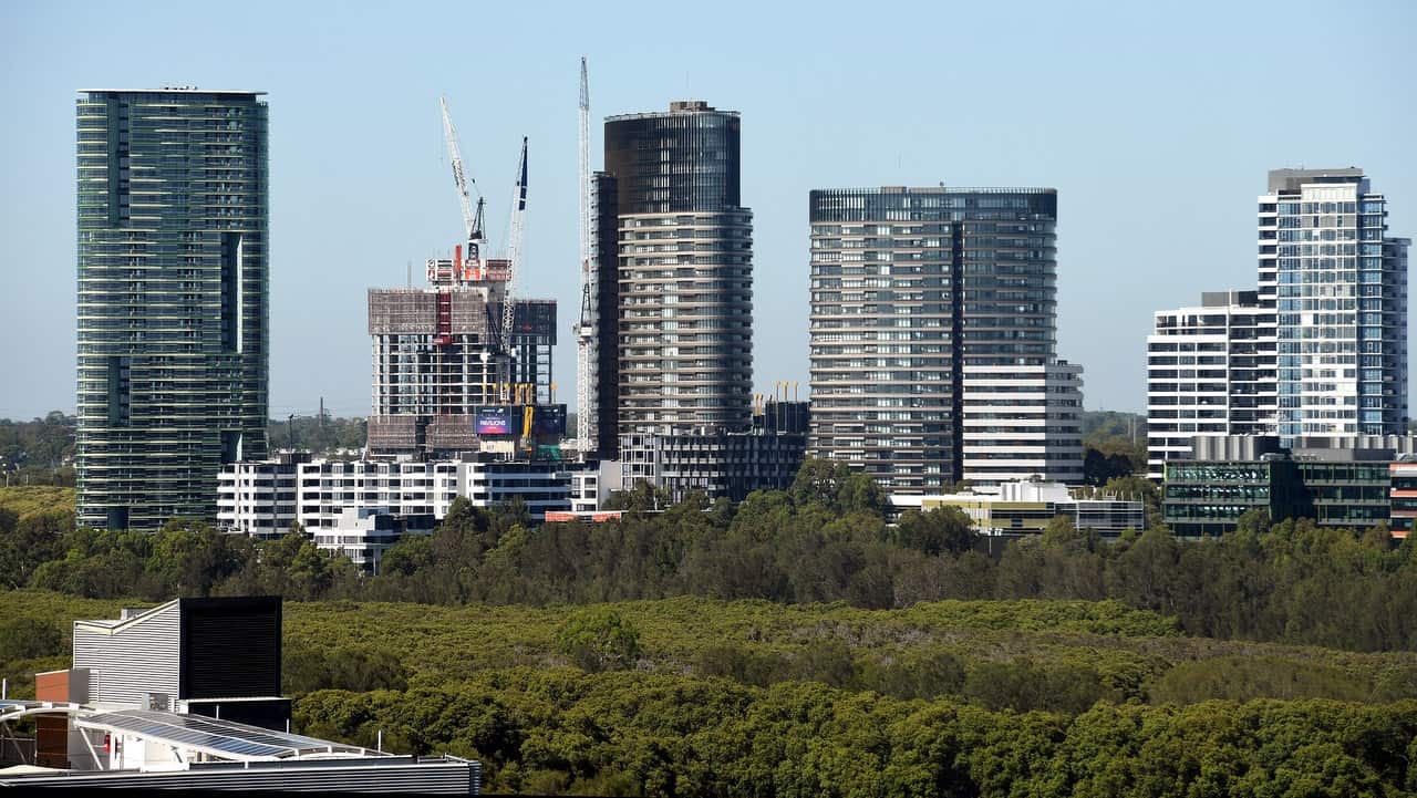 The Opal Tower (left) is seen at Sydney Olympic Park in Sydney, Monday, December 25, 2018.  