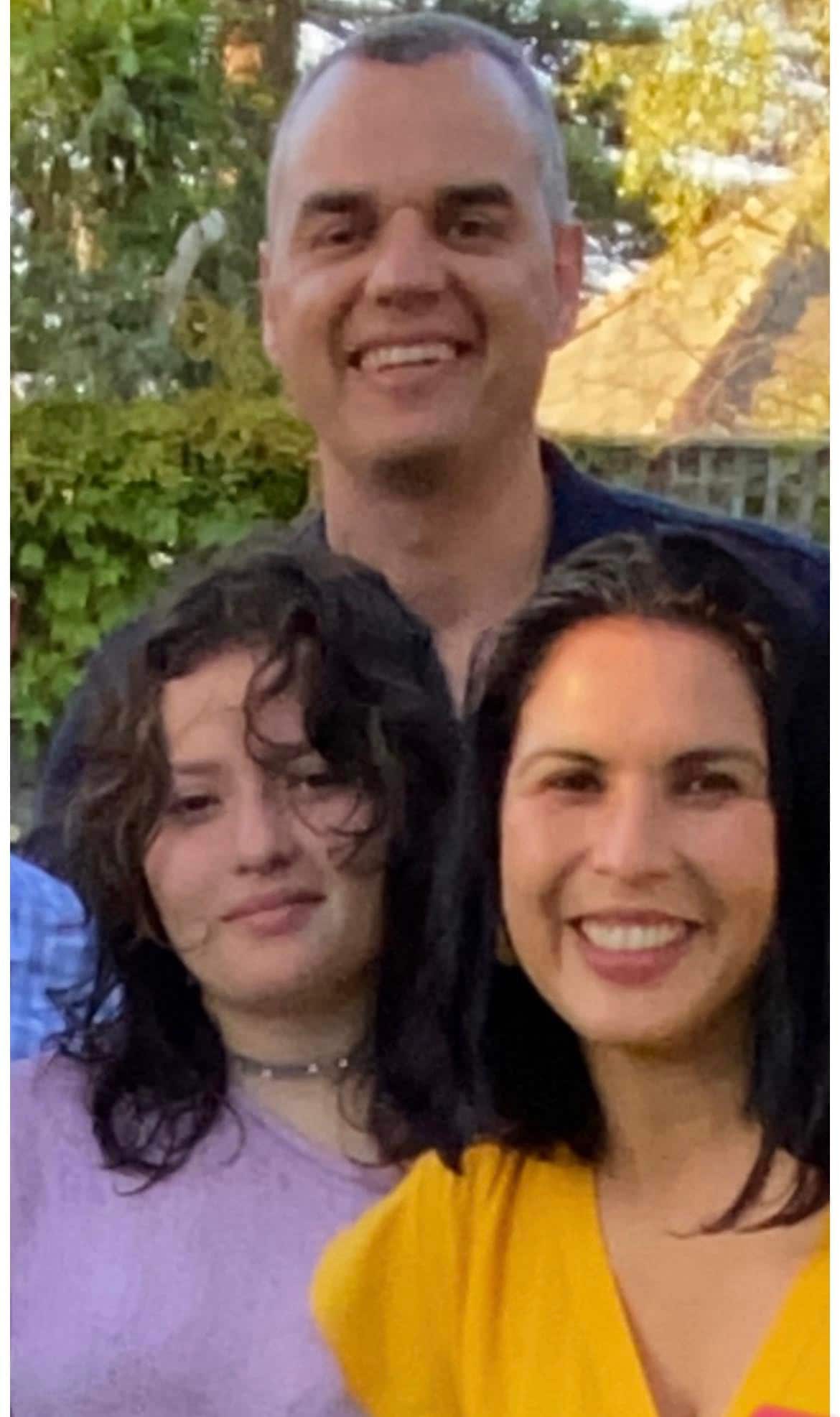 Olivia with her parents.