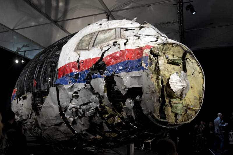 In this Tuesday, Oct. 13, 2015 file photo, the reconstructed wreckage of Malaysia Airlines Flight MH17 is put on display during a press conference in Gilze-Rijen, central Netherlands.
