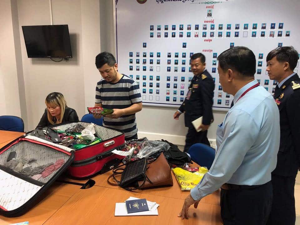 Police arrest an Australian woman allegedly with 1.8 kilograms of heroin hidden in a suitcase. Photo: Cambodia General Department of Immigration.