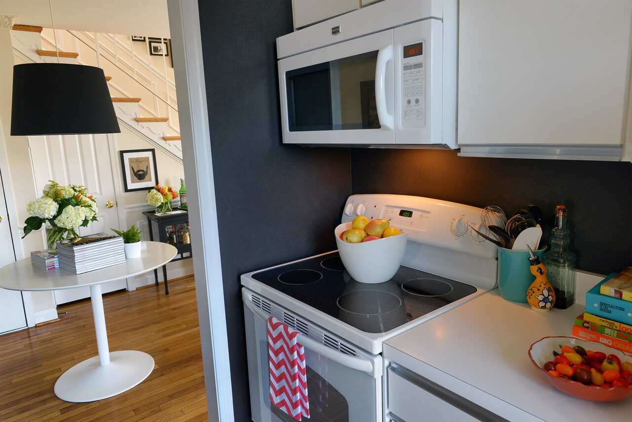 Huerta negotiated with her landlord to replace the range and microwave. They ended up splitting the cost. The stove has a glass top so it can be used for extra counter space.