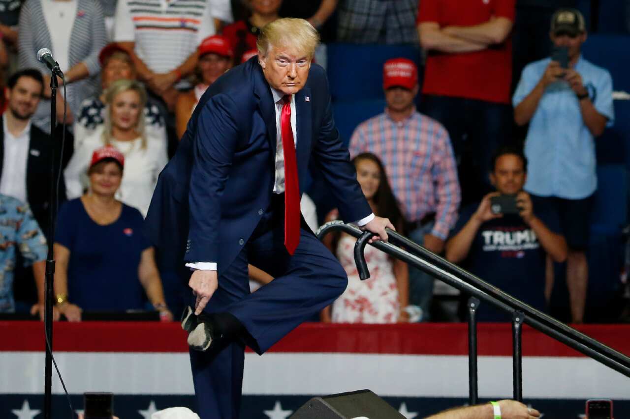 President Donald Trump points to the sole of his shoe during a campaign rally in Tulsa Oklahoma.