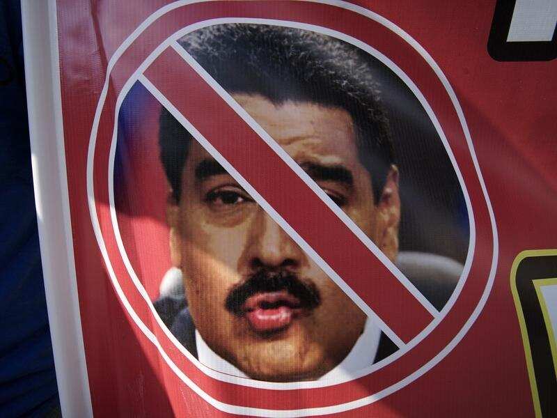 An anti-government poster showing Maduro's face