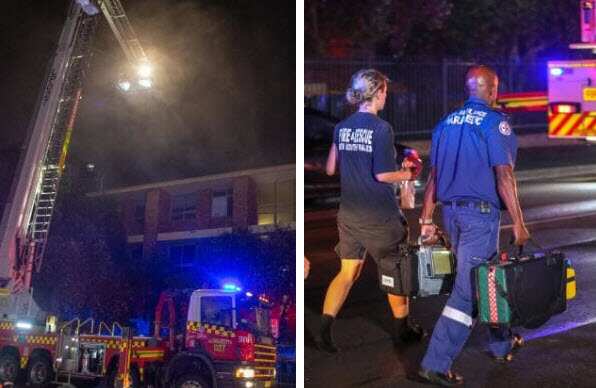 Paramedics walking to treat firefighters. Picture: Dead Asher