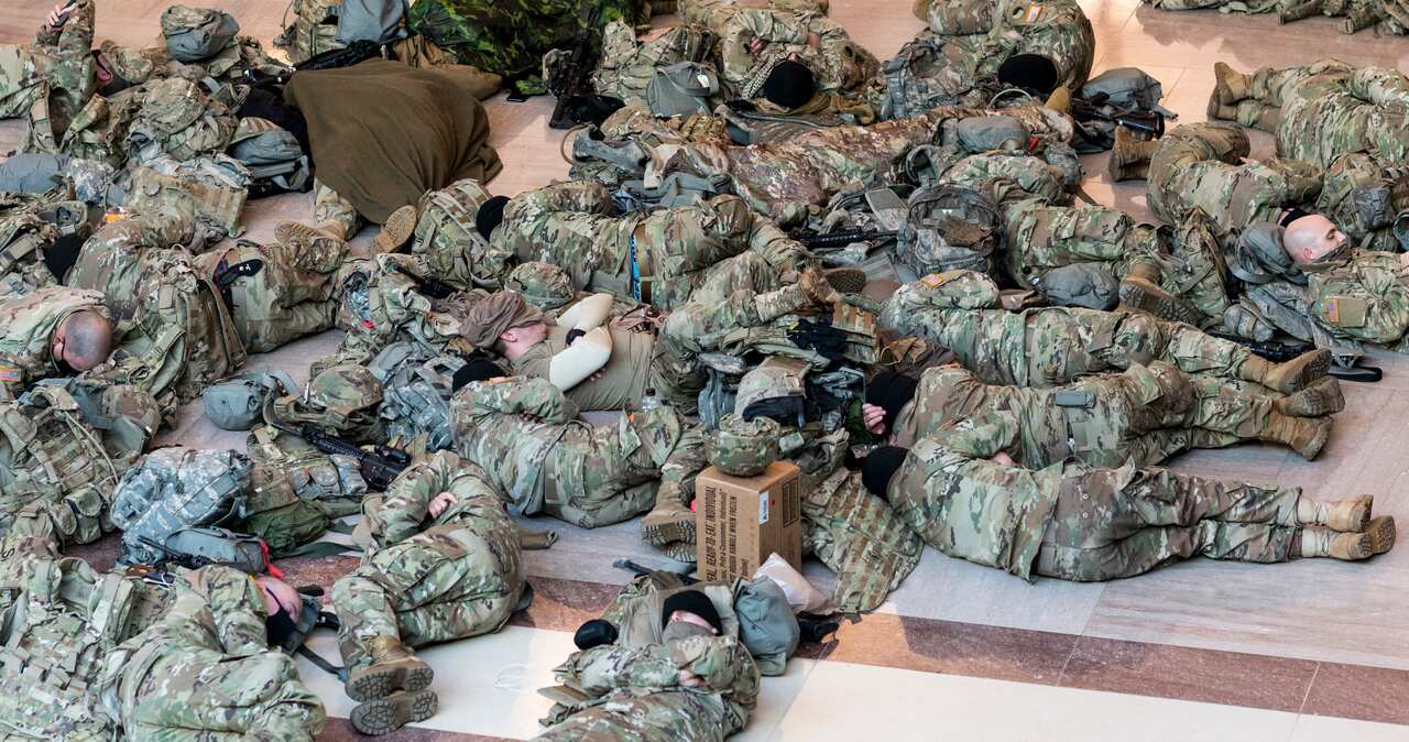 National Guard soldiers have been photographed sleeping in the Capitol building ahead of a House vote to impeach Donald Trump.