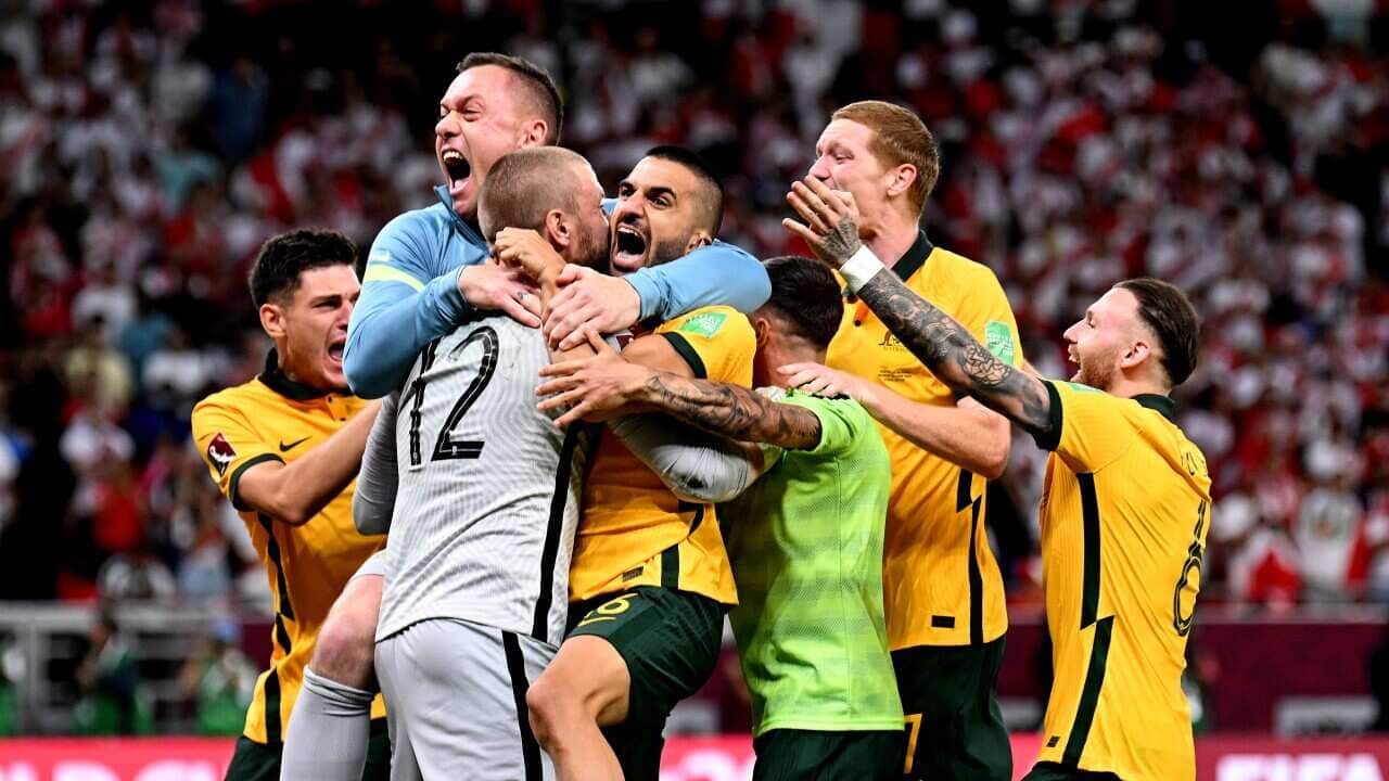 Australia celebrate after defeating Peru in the 2022 FIFA World Cup Playoff match between Australia Socceroos and Peru at Ahmad Bin Ali Stadium on 13 June, 2022 in Doha, Qatar.