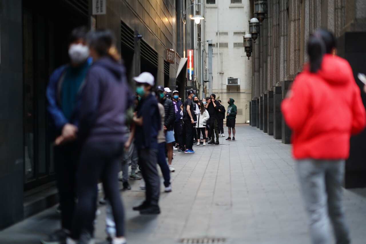 People queue for free food from Tian38 in Melbourne's CBD.