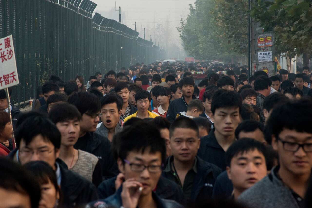 Workers heading to a Foxconn factory dedicated to iPhones in Zhengzhou, China, Oct. 20, 2015.