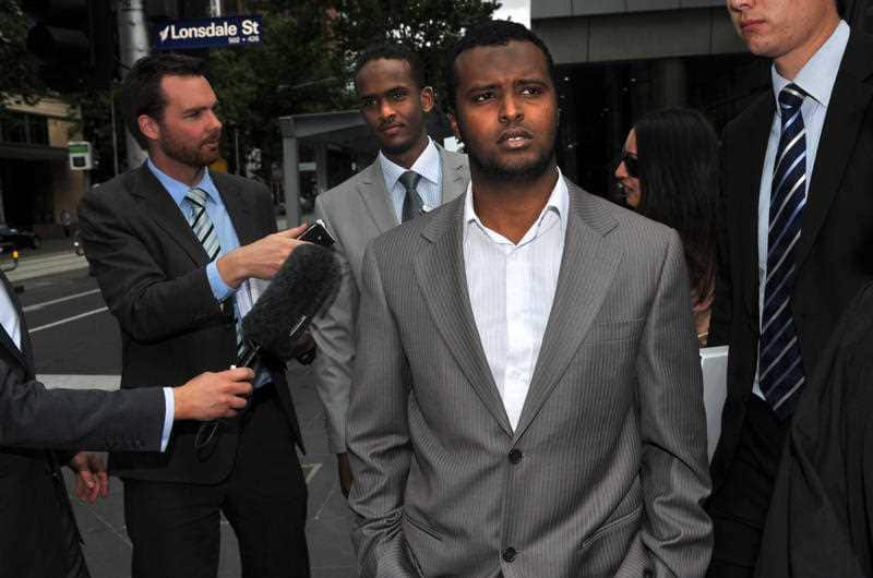 Yacqub Khayre (right) and Abdirahman Amend leave court in Melbourne, Thursday, Dec. 23, 2010. 