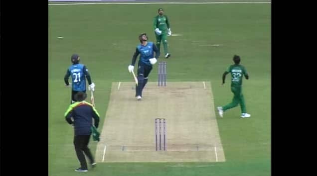 Pakistani bowler Hasan Ali about to catch the ball.