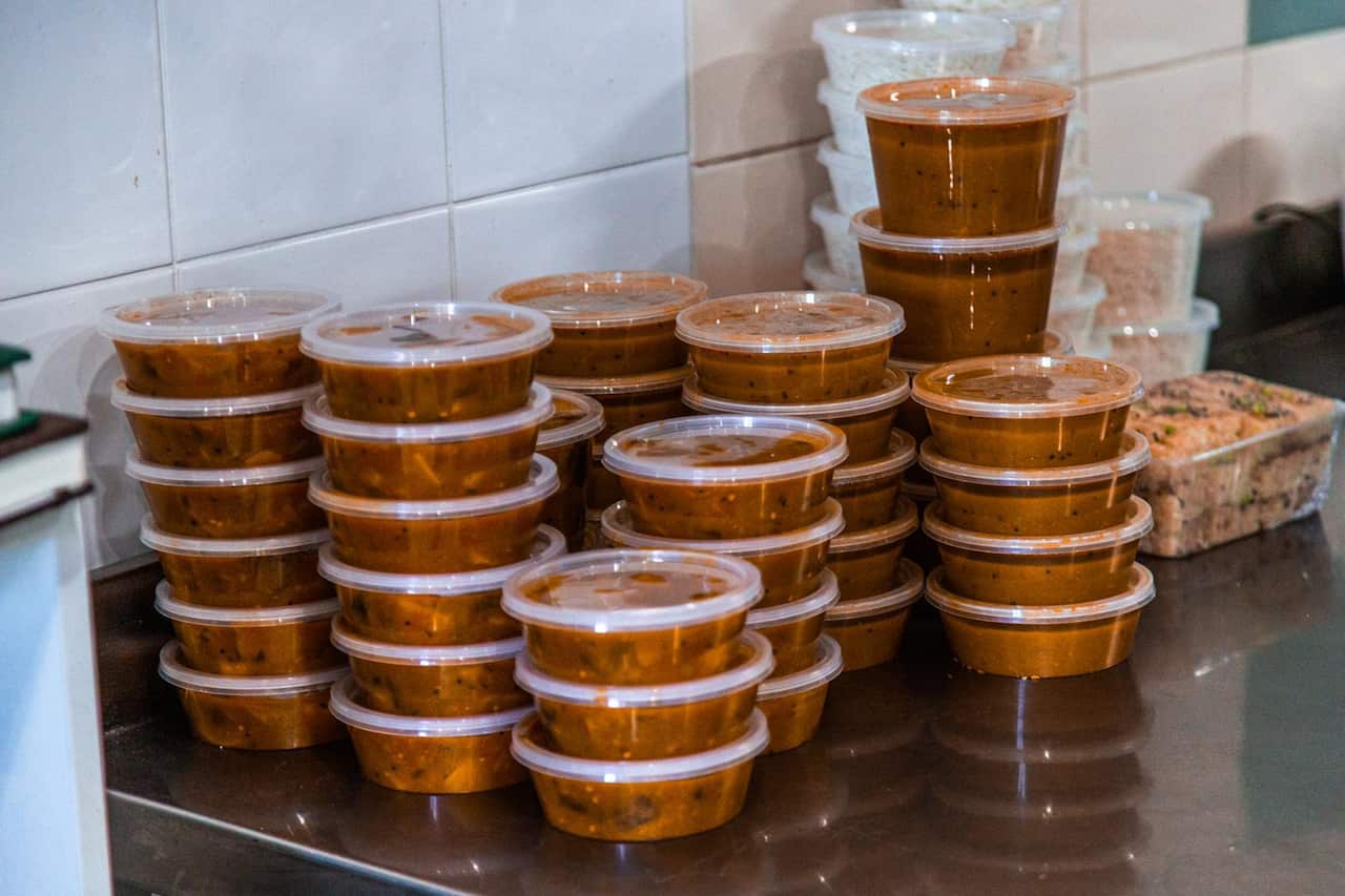 Food packets are being delivered to the needy people. 