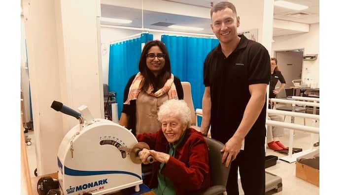 Dr Arooge Shafi with patients and staff member