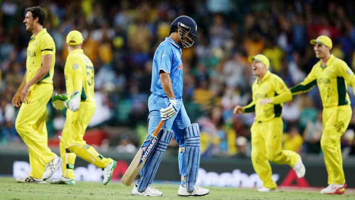 India's MS Dhoni walks from the field after he was run out for 65 runs while batting against Australia during their Cricket World Cup semifinal in Sydney, Australia, Thursday, March 26, 2015. (AP Photo/Rob Griffith)