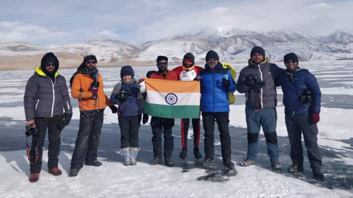 India's long-distance ice skater Vishwaraj Jadeja with his team at Lake Tsomoriri in Leh.