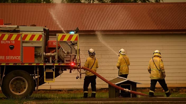 NSW Rural Fire Service crews protect property as the Gospers Mountain Fire approaches Bilpin, Saturday, December 21, 2019. Conditions are expected to worsen across much of NSW as temperatures tip 40C. (AAP Image/Dan Himbrechts) 