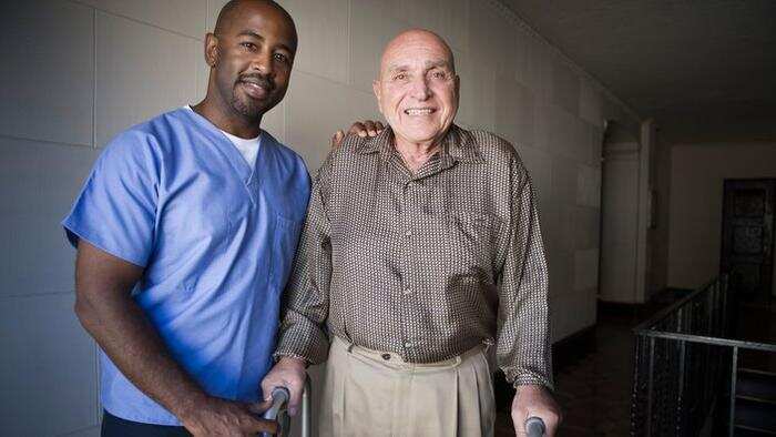 Healthcare worker with elderly man